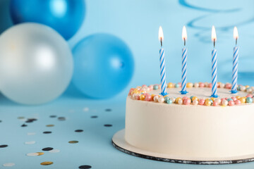 Fototapeta premium Tasty Birthday cake on blue background