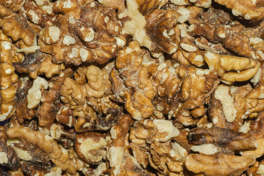 Shelled walnut kernels close-up background