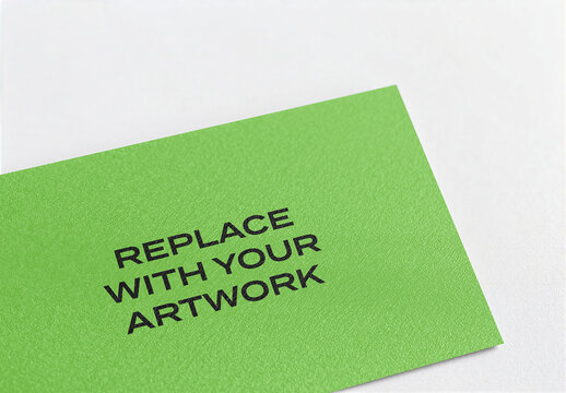Textured paper mockup with placeholder text on a white surface, stationery branding presentation, print design template for business card or brochure layout, interior office studio setting