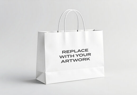 Paper shopping bag mockup with twisted rope handles displayed on a neutral surface, clean studio background for branding presentation, graphic design template, retail packaging