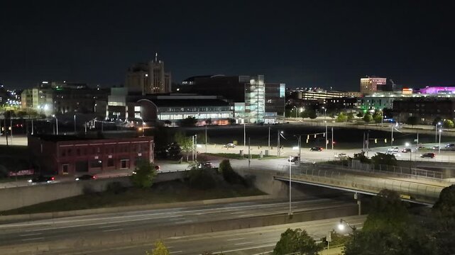 Detroit City Traffic on Freeway at Night With Buildings in Background
