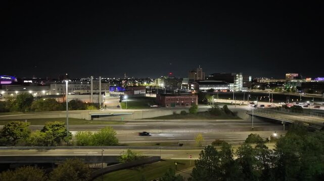 Detroit City Traffic on Freeway at Night With Buildings in Background