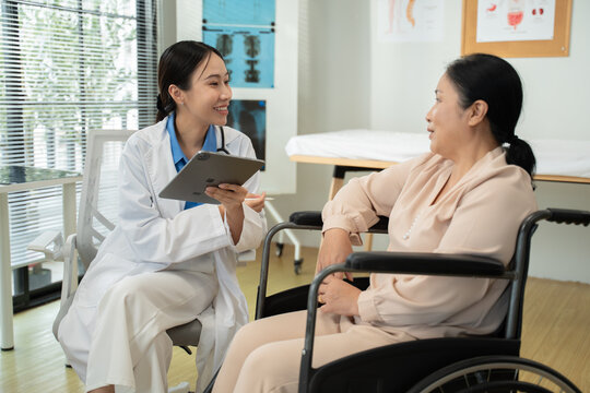 Doctor or Mental health and elderly care concept.Close up hands of doctor or caregiver hands elderly home care or hospital.Arthritis person's hand in support of geriatric nursing caregiver in hospital