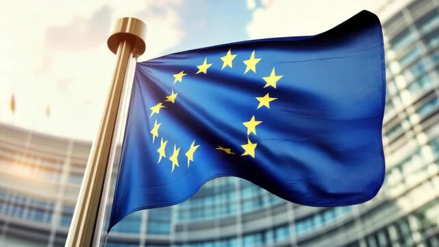 The vibrant blue European Union flag with a circle of gold stars, blowing in the breeze, symbolizing unity and strength.