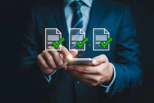 Businessman using smartphone to review document checklists with businessman