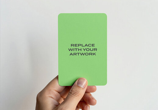 Vertical business card mockup held in hand against plain white background, realistic stationery presentation with placeholder text for artwork replacement, clean minimalist design