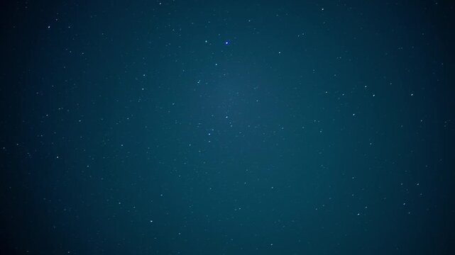Deep blue night sky filled with countless stars, creating a vast and infinite universe background