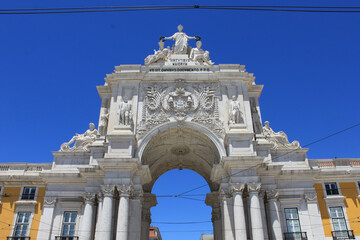 Rua Augusta Arch Arco da Rua Augusta Upper Facade and Sculptures View Against Blue Sky in Praca do Comercio Lisbon, Historic Triumphal Arch Architecture Travel Concept in Portugal © monkeybusiness.pt