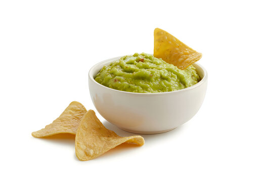 Fresh guacamole dip served in a bowl with tortilla chips for snacking or appetizers
