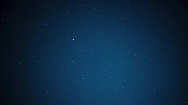 Dark blue night sky displaying numerous bright stars, creating a celestial background representing space, universe, and infinity