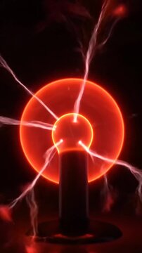 Electric arc forming around a plasma ball. Bright light and sparks appear as the arcs move