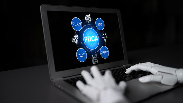 Modern Robot Hand Using Laptop to Illustrate PDCA Cycle in Business Management Framework for Continuous Improvement Strategy. Bitwise.
