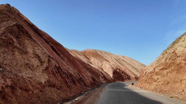 Driving through the colorful badlands of ALTASHI Geopark, Xinjiang