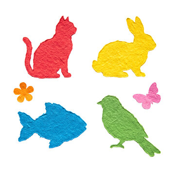 Playful set of six vibrant paper-cut shapes including animals, flower, butterfly, textured, isolated.
