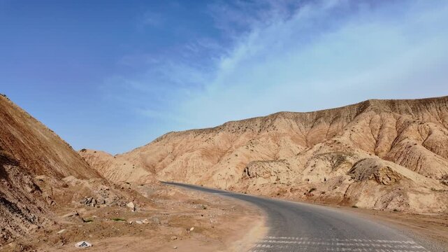 Driving through the colorful badlands of ALTASHI Geopark, Xinjiang