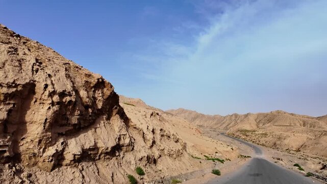 Driving through the colorful badlands of ALTASHI Geopark, Xinjiang