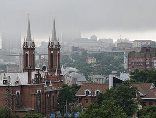 Obraz premium Catholic Church of the Most Holy Mother of God in foggy Vladivostok 