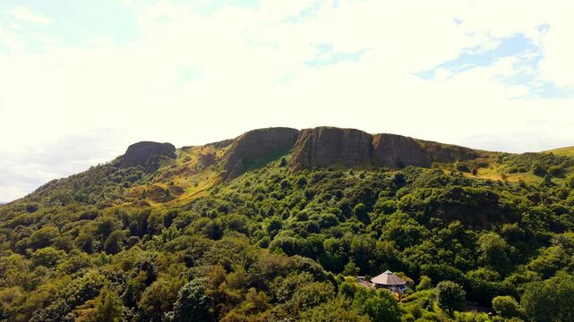 Rotating 4K 60FPS aerial video of Cavehill in North Belfast, Northern Ireland in the UK on a bright sunny day. Produced with Rec709 colour.