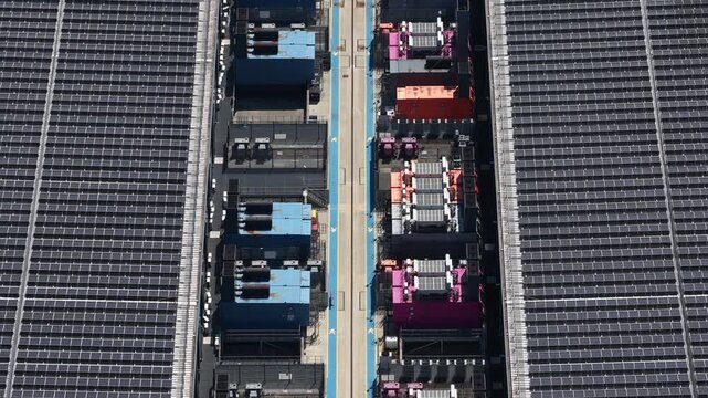 Aerial view of a large data center in the United Kingdom, showing building exterior, cooling equipment, backup power systems and infrastructure supporting cloud computing and big data.