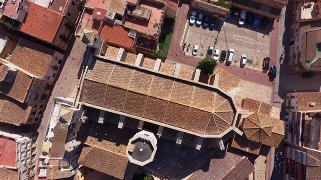 overhead view of Sant Julia de l'Arboc town center in Catalonia Spain showing terracotta rooftops, historic church roof and surrounding urban streets