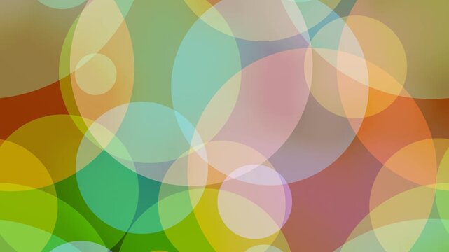 Vibrant multicolored translucent circles overlap to create a soft, ethereal loopable abstract background