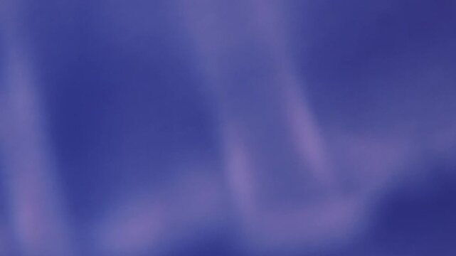 Defocused luminous reflection. Blue light spots. Vibrant color radiant texture optical flash on abstract illuminated creative visual art background.