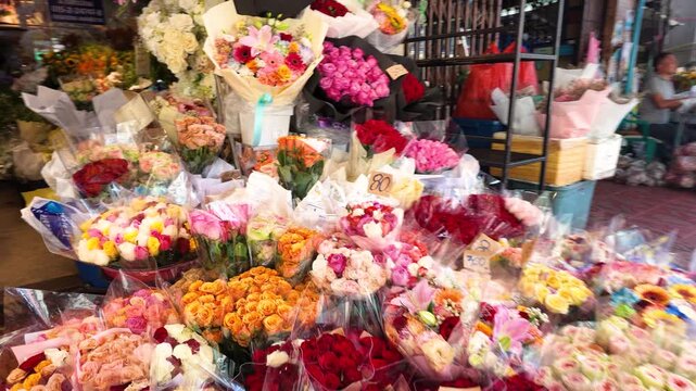 Vibrant Outdoor Flower Market Stall with Fresh Rose Bouquets