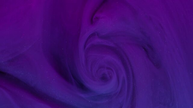 Curve ink fog. Dye spread. Defocused purple blue colorful glitter splash texture cloud flow on abstract acrylic creative background.