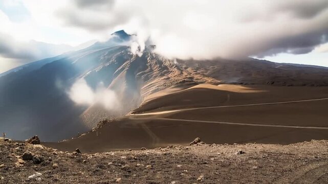 Mount Etna, Italy. Active volcano summit and volcanic landscape with fast moving clouds. Time lapse video.