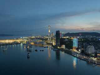 Fototapeta premium Ha Long waterfront skyline illuminated at twilight, Quang Ninh, Vietnam