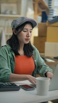 Women use laptop or phone for home office,package and e commerce checklist with stock to customer.Small business people with digital tech,logistics fulfillment,box and phone for online website order