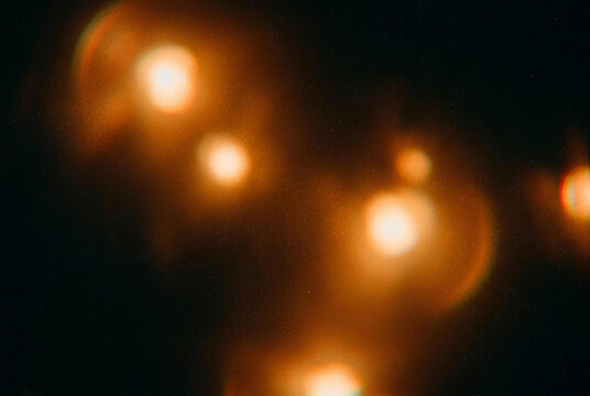 Warm film halation overlay with amber bloom and silver grain