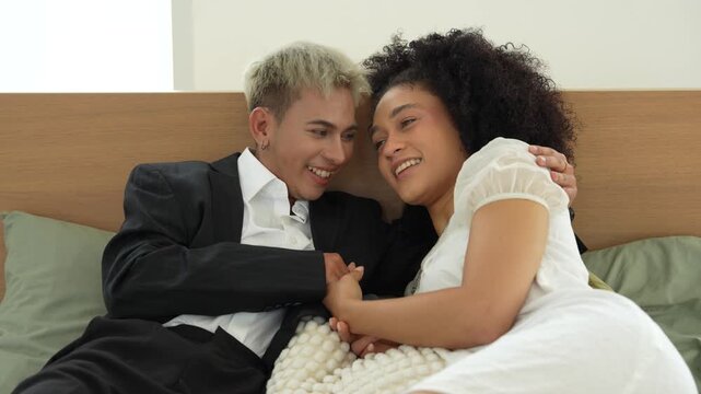 An LGBTQ couple, consisting of a gay man and a straight man, are relaxing on vacation at their holiday home.	