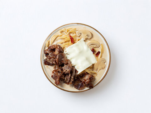 Cream sauce pasta with meat on a plate