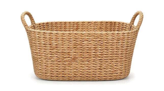 Empty rectangular woven wicker storage basket with sturdy handles isolated on white background for home organization laundry hamper and rustic interior design decoration.