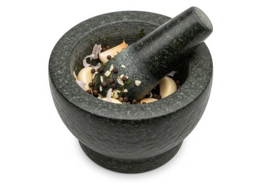 Stone mortar and pestle with garlic and black pepper