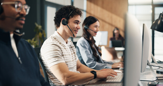 Call center, headset and happy man with computer, typing and communication with contact in business. Telemarketing, agent and person with mic, coworking and lead generation with technology in office
