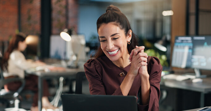 Happy, businesswoman and good news in office with laptop, email and notification of investment offer. Coworking, mature person smile or reading in workplace with computer, funding opportunity or deal