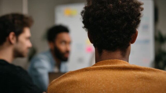 Diverse Creative Team Brainstorming Together in Modern Office Meeting
