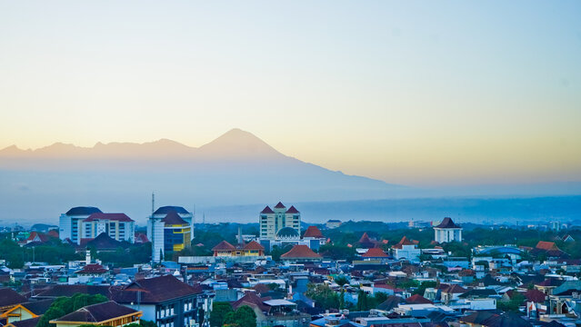 A beautiful view of the city of Malang with Mount Semeru in the background.