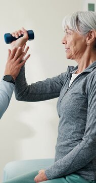 Happy, old woman or dumbbell exercise for physio, mobility improvement or functional screening. Clinic, worker or senior person with weights, physical therapy or fitness assistance in rehabilitation