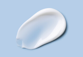cosmetic smears cream texture on pastel blue background