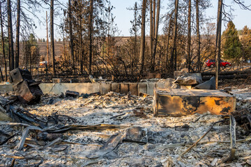 Spokane wildfire ground view of burned homes and neighborhood destruction © mdurson