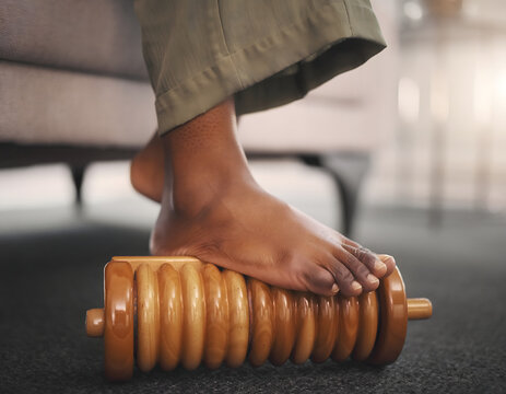 Relaxing wooden foot roller massager, soothing reflexology tool for foot pain relief and relaxation, promoting wellness and self-care, natural therapy for tired feet, home spa treatment