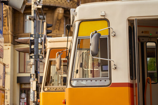 Yellow trams at city stop in Budapest