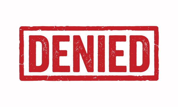 A red rectangular stamp displaying the word denied is isolated on a white background rejection refusal veto disapproval declination negation