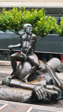 Frankfurt am Main, Deutschland. June 16, 2026. Public art monument of the biblical hero sitting on the defeated giant.