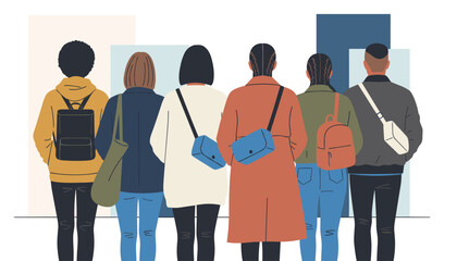 Obraz premium Rear view of six diverse young people wearing casual clothing and backpacks standing together in a line.