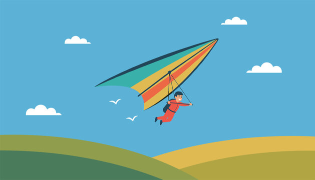 Adventurous man flying a colourful hang glider high in the sky over green hills on a bright sunny day.