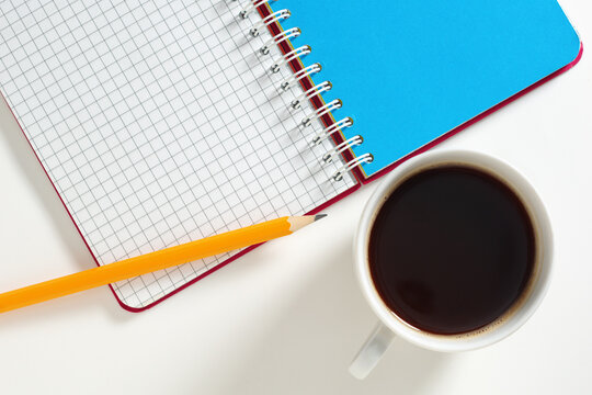 Coffee, Notebook and Pencil Flatly